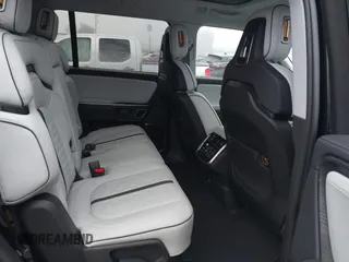 2024 Rivian R1S Adventure with VIN 7PDSGABA1RN035557, listed as a IAAI auction lot 41170478 with 5,210 mi miles. Bid and sale history available at carsss.com. Image 8.