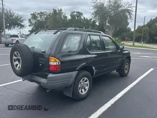 1999 Isuzu Rodeo S z VIN 4S2CK58W7X4357230, wystawiony jako Copart lot #45724855 z przebiegiem 130 446 mil mil oraz Czysty tytuł • Clean title. Historia ofert i sprzedaży dostępna na DreamBid. Obrazek 4.