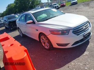 2013 Ford Taurus SEL z VIN 1FAHP2H81DG203809, wystawiony jako IAAI lot #42320729 z przebiegiem 162 917 mil mil oraz . Historia ofert i sprzedaży dostępna na DreamBid. Obrazek 1.