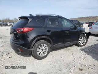 2016 Mazda CX-5 Touring z VIN JM3KE4CY0G0667171, wystawiony jako Copart lot #51579005 z przebiegiem 39 487 mil mil oraz Szkoda całkowita • Salvage title. Historia ofert i sprzedaży dostępna na DreamBid. Obrazek 3.