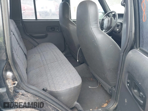 1999 Jeep Cherokee Sport z VIN 1J4FF68SXXL649633, wystawiony jako IAAI lot #41992258 z przebiegiem 121 042 mil mil oraz . Historia ofert i sprzedaży dostępna na DreamBid. Obrazek 8.