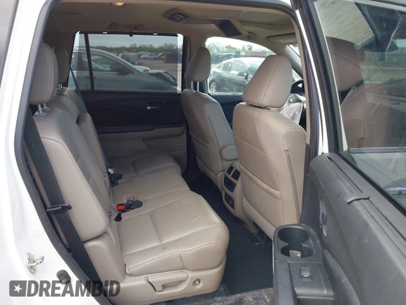 2017 Honda Pilot Touring with VIN 5FNYF6H9XHB034001, listed as a IAAI auction lot 42092549 with 142,422 mi miles and . Bid and sale history available at DreamBid. Image 8.