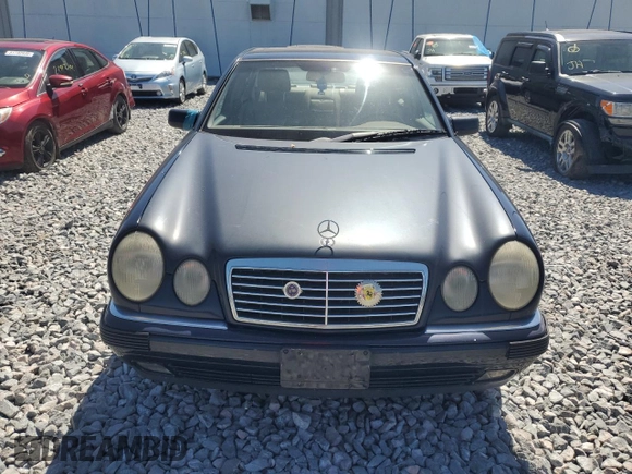 1998 Mercedes-Benz E with VIN WDBJF82F4WX012153, listed as a Copart auction lot 51848665 with 121,867 mi miles and Salvage Title. Bid and sale history available at DreamBid. Image 5.