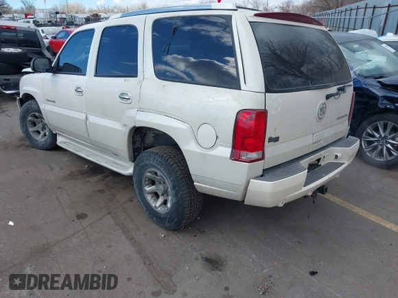 2003 Cadillac Escalade z VIN 1GYEK63N53R304400, wystawiony jako IAAI lot #41544697 z przebiegiem 207 913 mil mil oraz . Historia ofert i sprzedaży dostępna na DreamBid. Obrazek 3.