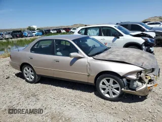 1996 Toyota Camry LE with VIN 4T1BF12K3TU132870, listed as a Copart auction lot 58052975 with 88,210 mi miles and Salvage title. Bid and sale history available at DreamBid. Image 4.