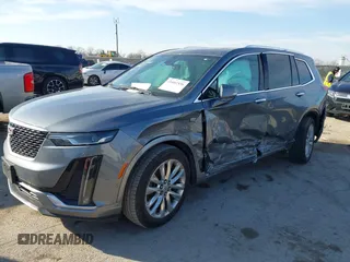 2020 Cadillac XT6 FWD Premium Luxury z VIN 1GYKPCRS8LZ129799, wystawiony jako IAAI lot #41602536 z przebiegiem 96 865 mil mil oraz . Historia ofert i sprzedaży dostępna na DreamBid. Obrazek 2.