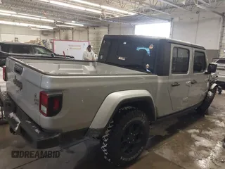 2023 Jeep Gladiator Sport S с VIN 1C6HJTAG1PL558131, выставлен на аукционе IAAI как лот 41252271 с пробегом 42 582 миль миль и . История ставок и продаж доступна на DreamBid. Изображение 4.