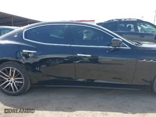 2015 Maserati Ghibli with VIN ZAM57XSA9F1146055, listed as a IAAI auction lot 41814633 with 88,783 mi miles. Bid and sale history available at carsss.com. Image 14.