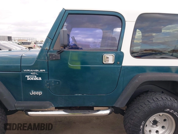 1998 Jeep Wrangler Sport with VIN 1J4FY19S7WP787679, listed as a IAAI auction lot 41764883 with 134,144 mi miles. Bid and sale history available at carsss.com. Image 14.