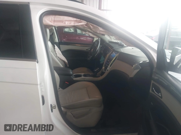 2014 Cadillac SRX z VIN 3GYFNAE32ES580480, wystawiony jako IAAI lot #42170765 z przebiegiem 148 245 mil mil oraz . Historia ofert i sprzedaży dostępna na DreamBid. Obrazek 5.