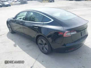 2020 Tesla Model 3 Standard Range Plus with VIN 5YJ3E1EAXLF643807, listed as a IAAI auction lot 41789406 with 49,256 mi miles. Bid and sale history available at carsss.com. Image 3.