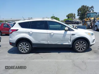 2018 Ford Escape Titanium with VIN 1FMCU0J94JUB26110, listed as a IAAI auction lot 42436285 with 59,586 mi miles and . Bid and sale history available at DreamBid. Image 13.