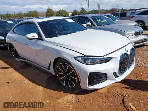 2023 BMW i4 eDrive40 z VIN WBY73AW08PFN72118, wystawiony jako IAAI lot #41849570 z przebiegiem 27 118 mil mil oraz . Historia ofert i sprzedaży dostępna na DreamBid. Obrazek 1.