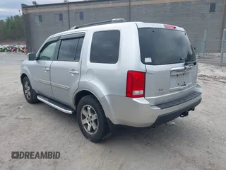 2011 Honda Pilot Touring with VIN 5FNYF4H90BB022354, listed as a IAAI auction lot 41965082 with 126,505 mi miles and . Bid and sale history available at carsss.com. Image 3.