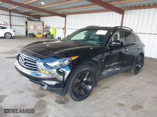 2016 Infiniti QX70 with VIN JN8CS1MW2GM752589, listed as a IAAI auction lot 41826357 with 142,469 mi miles. Bid and sale history available at carsss.com. Image 2.