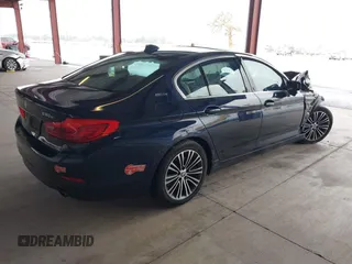 2019 BMW 5 Series 530e with VIN WBAJA9C50KB254535, listed as a IAAI auction lot 41094049 with 57,874 mi miles and . Bid and sale history available at DreamBid. Image 4.