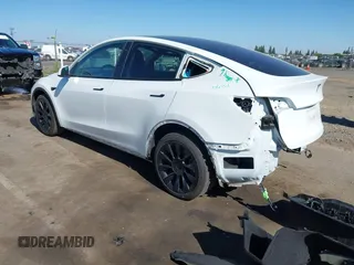 2022 Tesla Model Y Long Range with VIN 7SAYGDEE1NF364241, listed as a IAAI auction lot 42190272 with 54,878 mi miles and . Bid and sale history available at DreamBid. Image 3.