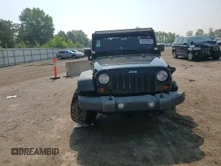 2012 Jeep Wrangler Unlimited Sport with VIN 1C4BJWDG8CL116811, listed as a Copart auction lot 59372085 with 95,498 mi miles and Salvage title. Bid and sale history available at DreamBid. Image 13.