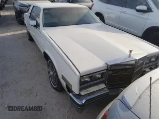 1985 Cadillac Eldorado z VIN 1G6EL5782FE630140, wystawiony jako Copart lot #76367454 z przebiegiem 29 850 mil mil oraz Szkody całkowita. Historia ofert i sprzedaży dostępna na DreamBid. Obrazek 5.