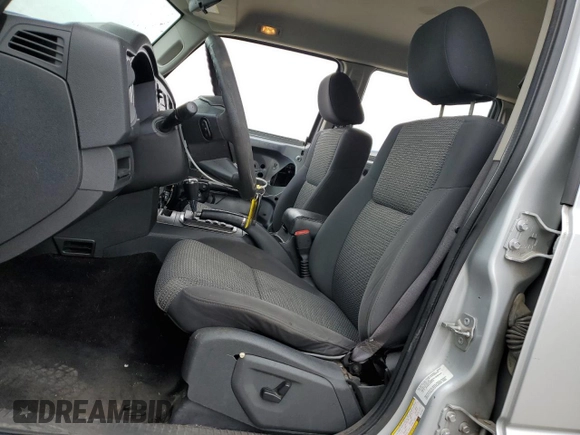 2010 Jeep Commander Sport with VIN 1J4RG4GK2AC121821, listed as a Copart auction lot 57793545 with 171,405 mi miles and Salvage title. Bid and sale history available at DreamBid. Image 7.