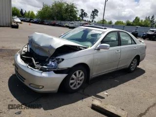 2004 Toyota Camry LE with VIN JTDBE32K540273354, listed as a Copart auction lot 57633245 with 203,326 mi miles and Salvage title. Bid and sale history available at DreamBid. Image 1.