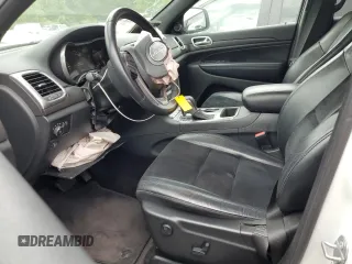 2018 Jeep Grand Cherokee Laredo E with VIN 1C4RJEAGXJC430096, listed as a Copart auction lot 57391405 with 89,248 mi miles and Salvage title. Bid and sale history available at DreamBid. Image 7.