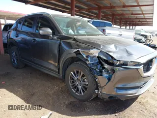 2021 Mazda CX-5 Touring with VIN JM3KFACM2M1313750, listed as a IAAI auction lot 41762938 with 68,503 mi miles. Bid and sale history available at carsss.com. Image 1.