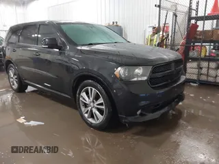 2013 Dodge Durango R/T with VIN 1C4SDHCT7DC561687, listed as a IAAI auction lot 41207408 with 152,360 mi miles and . Bid and sale history available at DreamBid. Image 1.