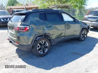 2018 Jeep Compass Trailhawk with VIN 3C4NJDDB0JT241163, listed as a IAAI auction lot 41986193 with 89,246 mi miles and . Bid and sale history available at DreamBid. Image 4.