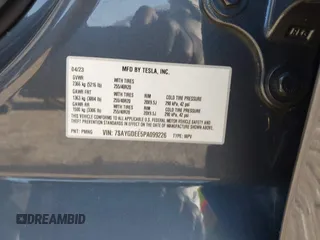 2023 Tesla Model Y Long Range z VIN 7SAYGDEE5PA099226, wystawiony jako IAAI lot #42004061 z przebiegiem 10 607 mil mil oraz . Historia ofert i sprzedaży dostępna na DreamBid. Obrazek 9.
