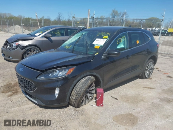 2021 Ford Escape Titanium with VIN 1FMCU9J95MUA77427, listed as a IAAI auction lot 42227275 with 75,079 mi miles and . Bid and sale history available at DreamBid. Image 2.