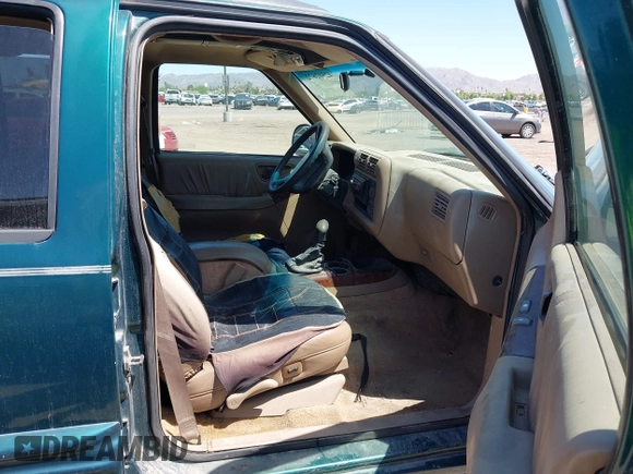 1996 Oldsmobile Bravada z VIN 1GHDT13W5T2711291, wystawiony jako IAAI lot #42502672 z przebiegiem 219 062 mil mil oraz . Historia ofert i sprzedaży dostępna na DreamBid. Obrazek 5.