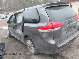 2014 Toyota Sienna L with VIN 5TDZK3DC9ES510214, listed as a IAAI auction lot 41721667 with 1 mi miles. Bid and sale history available at carsss.com. Image 3.