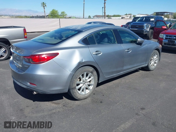 2014 Mazda 6 i Sport with VIN JM1GJ1U61E1151348, listed as a IAAI auction lot 42248173 with 275,764 mi miles and . Bid and sale history available at DreamBid. Image 4.