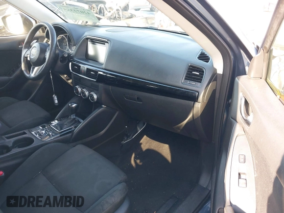 2016 Mazda CX-5 Sport with VIN JM3KE2BY8G0864983, listed as a IAAI auction lot 42072385 with 141,104 mi miles. Bid and sale history available at carsss.com. Image 5.