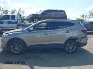 2017 Hyundai Santa Fe 2.4L z VIN 5NMZU3LB7HH025791, wystawiony jako IAAI lot #42277964 z przebiegiem 154 110 mil mil oraz . Historia ofert i sprzedaży dostępna na DreamBid. Obrazek 14.