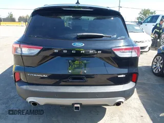 2020 Ford Escape Titanium z VIN 1FMCU9J97LUB18350, wystawiony jako IAAI lot #42574736 z przebiegiem 82 551 mil mil oraz . Historia ofert i sprzedaży dostępna na DreamBid. Obrazek 17.