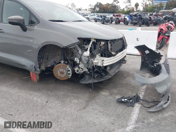 2023 Chrysler Pacifica Hybrid Touring L with VIN 2C4RC1L71PR584485, listed as a IAAI auction lot 42056423 with 58,955 mi miles and . Bid and sale history available at DreamBid. Image 6.