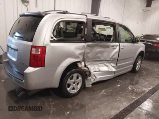 2010 Dodge Grand Caravan SXT with VIN 2D4RN5D15AR261319, listed as a IAAI auction lot 41877022 with 142,292 mi miles and . Bid and sale history available at DreamBid. Image 4.