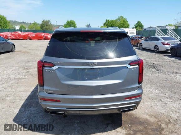 2022 Cadillac XT6 Premium Luxury z VIN 1GYKPDRS4NZ146284, wystawiony jako IAAI lot #42150678 z przebiegiem 28 890 mil mil oraz . Historia ofert i sprzedaży dostępna na DreamBid. Obrazek 17.