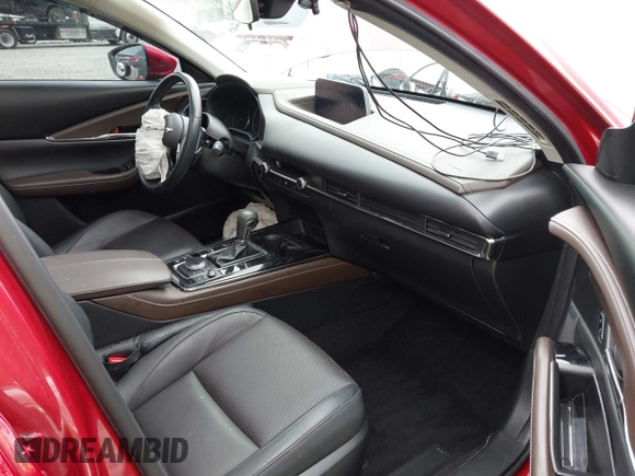2023 Mazda CX-30 S Premium with VIN 3MVDMBDM1PM520048, listed as a IAAI auction lot 42468172 with 7,277 mi miles and . Bid and sale history available at DreamBid. Image 5.