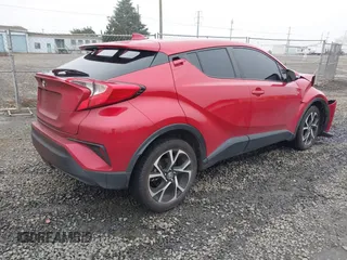 2021 Toyota C-HR LE with VIN JTNKHMBX1M1104530, listed as a IAAI auction lot 41324350 with 53,112 mi miles. Bid and sale history available at carsss.com. Image 4.