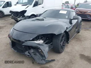 2021 Toyota Supra 2.0 with VIN WZ1DB2C07MW042723, listed as a IAAI auction lot 42635977 with 54,011 mi miles and . Bid and sale history available at DreamBid. Image 2.