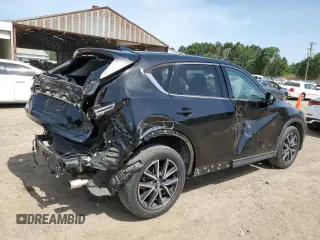 2018 Mazda CX-5 Grand Touring z VIN JM3KFADM2J1381752, wystawiony jako Copart lot #56889835 z przebiegiem 96 820 mil mil oraz Szkoda całkowita • Salvage title. Historia ofert i sprzedaży dostępna na DreamBid. Obrazek 3.