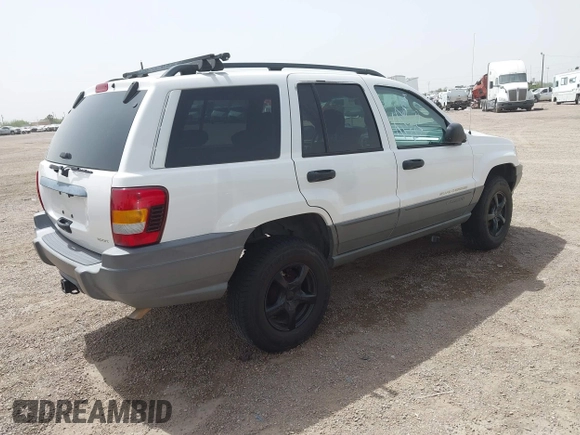 2002 Jeep Grand Cherokee with VIN 1J8GW38S62C219396, listed as a IAAI auction lot 41831930 with 196,167 mi miles and . Bid and sale history available at DreamBid. Image 4.