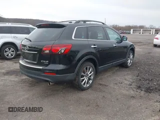 2015 Mazda CX-9 Grand Touring z VIN JM3TB3DV6F0464926, wystawiony jako IAAI lot #42035670 z przebiegiem 168 257 mil mil oraz . Historia ofert i sprzedaży dostępna na DreamBid. Obrazek 4.