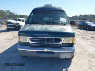 1999 Ford Econoline Cargo with VIN 1FDRE14W2XHB18989, listed as a IAAI auction lot 41740961 with 152,028 mi miles. Bid and sale history available at carsss.com. Image 6.