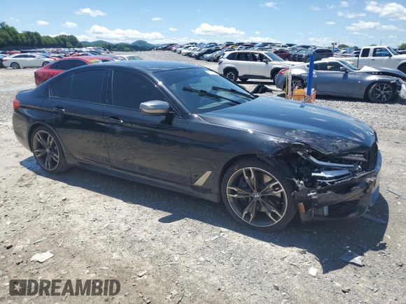 2019 BMW 5 Series M550i xDrive with VIN WBAJB9C53KB289356, listed as a Copart auction lot 57814535 with 60,454 mi miles and Clean title. Bid and sale history available at DreamBid. Image 4.