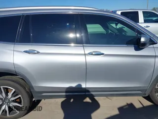 2020 Honda Pilot Touring 8-Passenger with VIN 5FNYF6H95LB021455, listed as a IAAI auction lot 41187609 with 35,589 mi miles and . Bid and sale history available at DreamBid. Image 13.