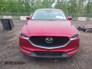 2020 Mazda CX-5 Grand Touring with VIN JM3KFBDM7L1731837, listed as a IAAI auction lot 42160795 with 63,826 mi miles and . Bid and sale history available at DreamBid. Image 13.